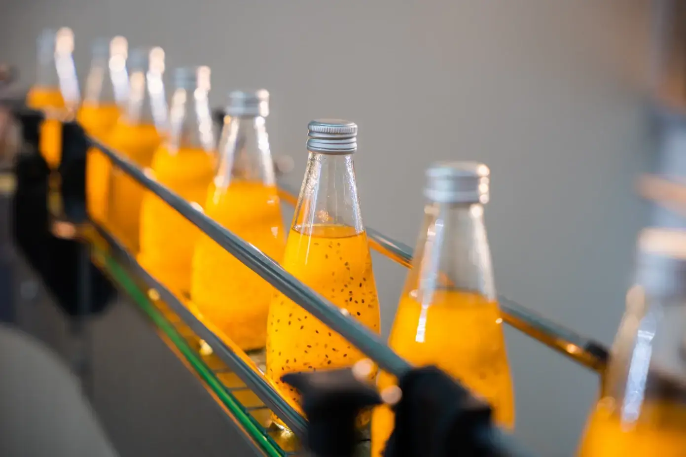 Industrial beverage bottling line with orange juice